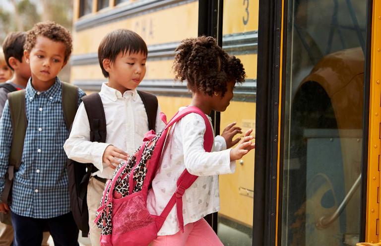 The iconic yellow school bus, reimagined: autonomous cars offer children a safer, greener transportation.
