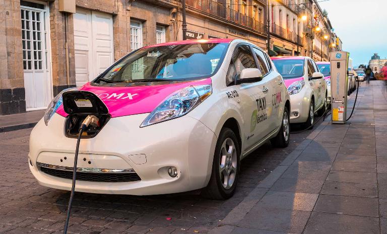 Growing demand for electric vehicles: Nissan Leaf taxis are being charged in Mexico City, Mexico.