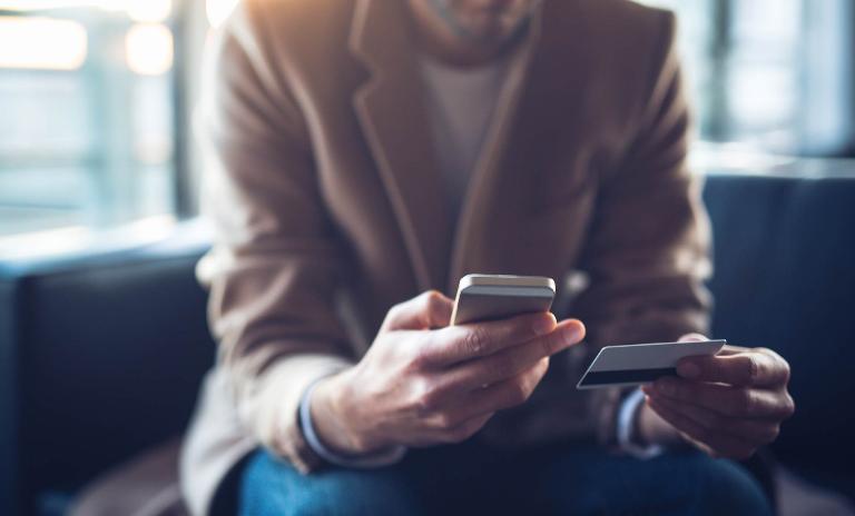 Person making purchase on mobile phone