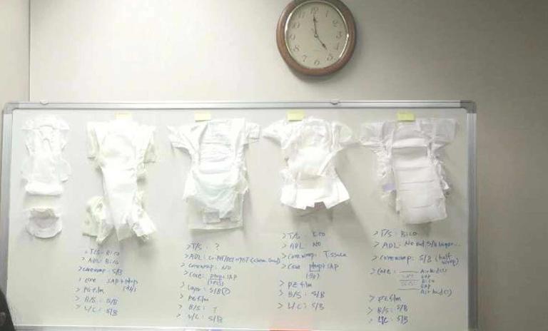 The white board with diapers and hygiene pads
